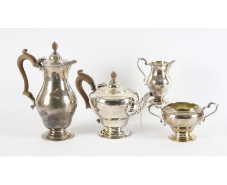 Four piece silver coffee and tea service of ovoid form with foliate handles and spout on pedestal feet by Nayler Brothers, Lo