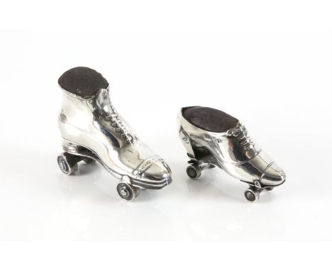 Silver novelty pin cushion in the form of a lady`s boot with roller skate by Crisford & Norris Ltd, Birmingham 1909, 7cm, and