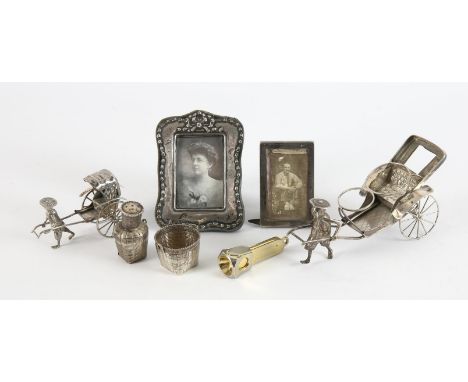 Chinese silver table cruet in the form of a rickshaw, another Chinese silver rickshaw, two small silver photograph frames and