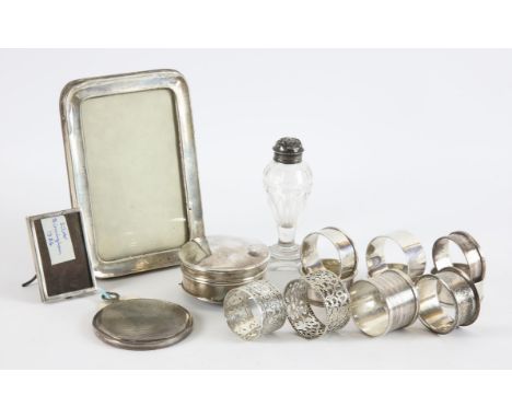 Mixed lot of nine serviette ring, Georgian class and silver mounted pepper shaker, ring box, two photo frames and a small mir