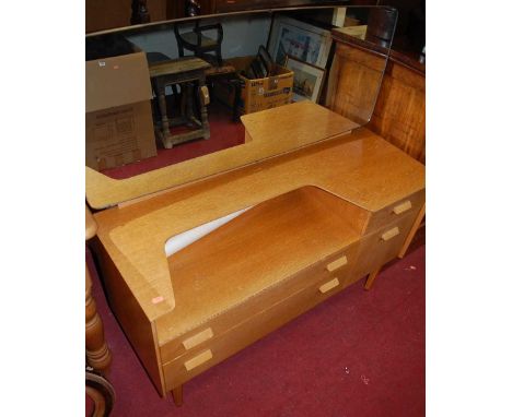A G-Plan light oak chest of six long drawers, w.61cm; together with a matching mirrorback dressing chest, w.115cm (2)