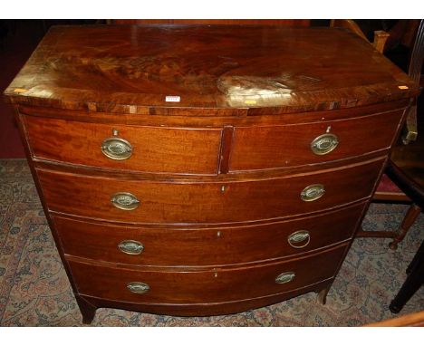 A Victorian mahogany bowfront chest of two short over three long drawers, raised on splayed feet, width 102cm