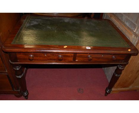 A Victorian mahogany round corner writing table, with green leather inset top and twin frieze drawers, w.106cm
