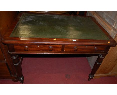 A Victorian mahogany round corner writing table, with green leather inset top and twin frieze drawers, w.106cm