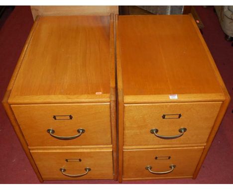 A pair of Art Deco light oak and plywood low two-drawer office filing chests, each w.45.5cm