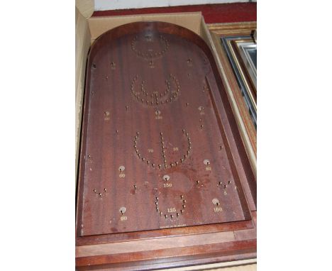 A bagatelle board in box; together with Mikado pick-up sticks