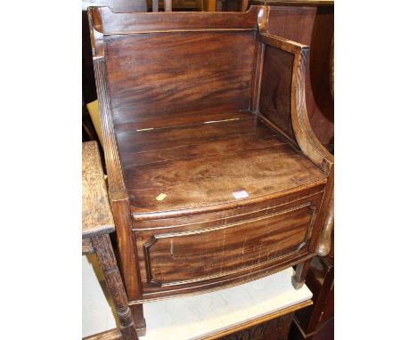 A 19th century Lancashire? mahogany commode, having a raised back above a hinged seat, w.55cm