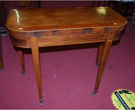 A late George III rosewood and satinwood crossbanded card table, having a D-shaped fold-over top above a baize lined playing 