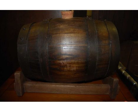 A 20th century coopered oak barrel on stand, h.34cmCondition report: Very good condition with some light surface wear and mar