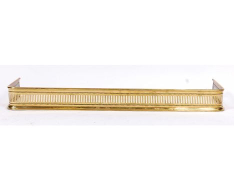A Victorian brass D-shaped fire fender, with pierced and beaded decoration, w.121cm, h.12.5cm 
