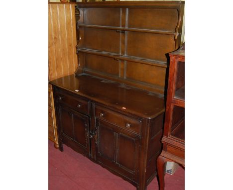 An Ercol dark elm dresser