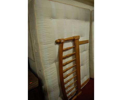 A modern good quality double bed, comprising twin base section, mattress, and pine headboard 