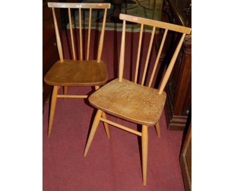 A pair of Ercol blond elm stick back kitchen chairs