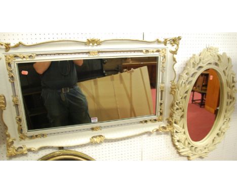 A white painted and gilt decorated rectangular wall mirror; together with a cream floral painted oval wall mirror (2)    Cond