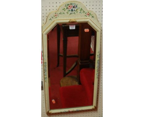A cream framed and floral decorated bevelled rectangular wall mirror