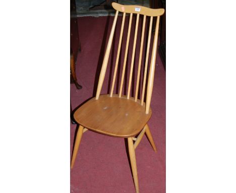 A set of four Ercol blond elm stickback dining chairs