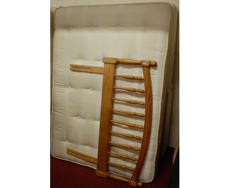 A modern good quality double bed, comprising twin base section, mattress, and pine headboard 