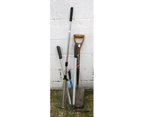 A small selection of gardening tools. Including a spade, etc.All items in this auction are sold as seen, We are unable to pro