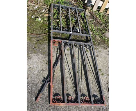 A tall iron gate with post. With remains of black paint, H182cm x W64cm.All items in this auction are sold as seen, We are un