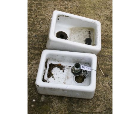 A pair of small Rowanco white ceramic sinks. H15cm x W40cm x D30cmAll items in this auction are sold as seen, We are unable t