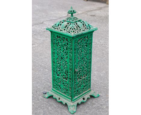 A cast metal garden heater. Of rectangular form, painted green with pierced details and a finial, H61cmAll items in this auct