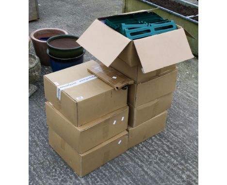 Eight boxes of plastic garden track. Unused, each box containing 24 garden track tile mouldings and 48 tile linking clipsAll 