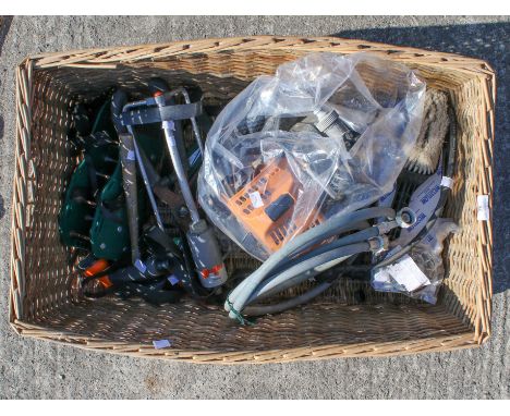 A 2-stroke water pump and assorted tools. The pump appears unused and has the original manual, together with pipes, a brush, 