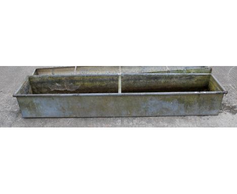 A large galvanised trough. H38.5cm x W250cm x D52cmAll items in this auction are sold as seen, We are unable to provide condi