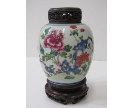 ORIENTAL CERAMICS, famille rose ginger jar with pierced hardwood cover, peony blossom within rocky outcrop, overall height in