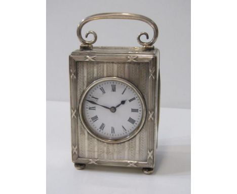 EDWARDIAN SILVER BEDROOM CLOCK, engine turned decoration with drop handle, London 1907, maker Shepheard &amp; Co, 9.5cm heigh
