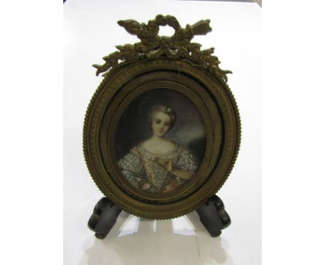 MINIATURE PORTRAIT, ornate gilt metal oval surround portrait of a young lady in embroidered dress, 18cm height 