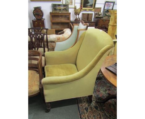 EARLY VICTORIAN MAHOGANY FRAMED WING ARMCHAIR with gold upholstery, original castors. One short line mark to upholstyer and s