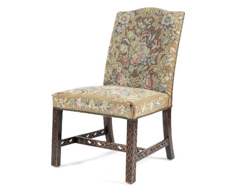 A GEORGE III MAHOGANY SIDE CHAIRIN THE MANNER OF ALEXANDER PETER, C.1770the arched back and seat covered with petit point nee