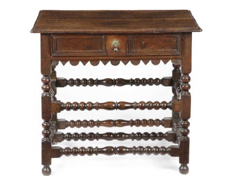 A WILLIAM AND MARY OAK SIDE TABLELATE 17TH CENTURYwith a panelled frieze drawer above an unusual dog tooth and demi-lune frie