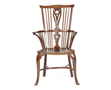 A GEORGE III YEW AND ELM WINDSOR ARMCHAIR LATE 18TH CENTURYwith a comb back and a pierced splat, on front cabriole legs unite