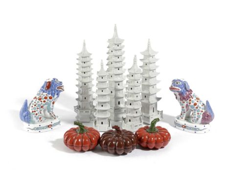 FIVE CERAMIC MODELS OF CHINESE PAGODASMODERNtogether with a pair of kakiemon lion dogs by Mottahedeh after the originals at B