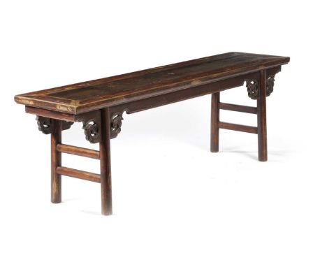 A CHINESE STAINED ELM AND PINE BENCHLATE QING DINASTYwith scroll and leaf carved decoration53.8cm high, 165.2cm wide, 38cm de
