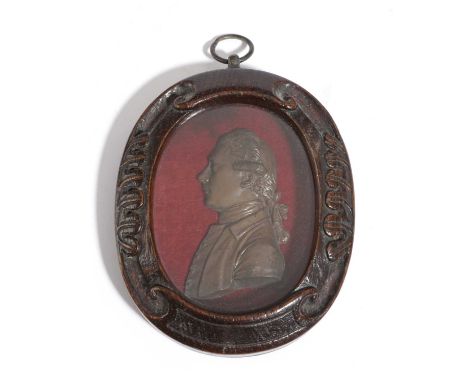 A GEORGE III WAX PORTRAIT BUST OF SIR JOSEPH BANKSAFTER JOHN FLAXMAN JR, C.1780-90in an oval carved oak frame11.5 x 9.5cm max