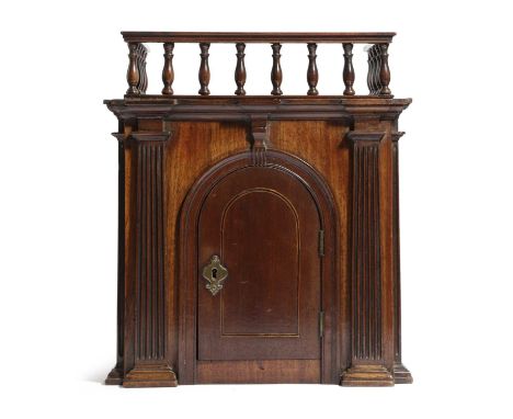 A GEORGE III MAHOGANY ARCHITECTURAL CABINETC.1780with a balustrade gallery above an arched door flanked by fluted pilasters36