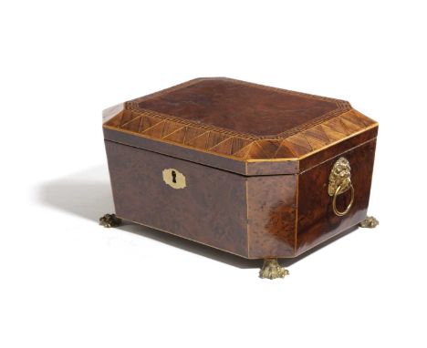 λ A REGENCY BURR YEW CASKETEARLY 19TH CENTURYof canted rectangular form, the cover with a Greek key and triangular rosewood b