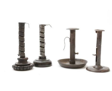 TWO 'PIGTAIL' IRON AND TREEN SPIRAL CANDLE HOLDERS18TH / 19TH CENTURYwith turned and carved wooden bases, together with a tin