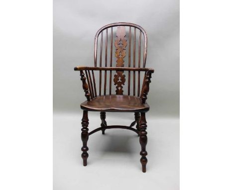 A 19th century provincial hoop stick &amp; pierced splat back, open armchair, yew wood with an elm seat, and crinoline stretc