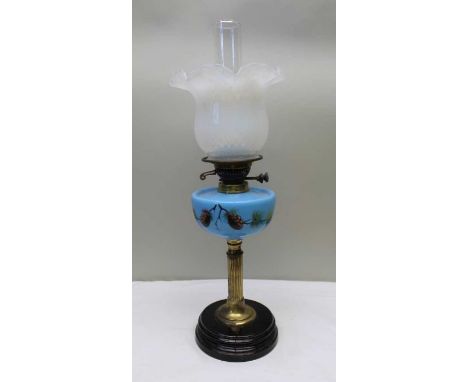 A late Victorian oil lamp, blue glass reservoir with pine cone decoration, having fluted rim, opaline shade, on brass stem an