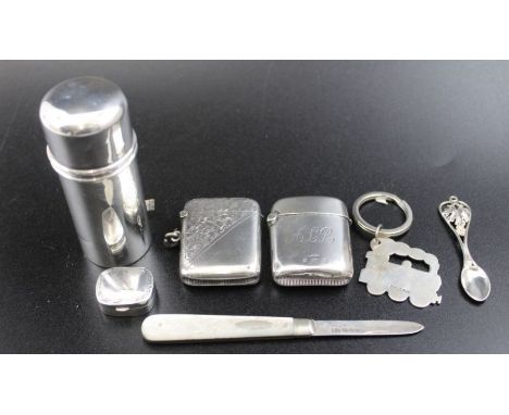 A silver shaving container Birmingham 1920 with original bar of soap, two silver vesta cases, a silver pill box, silver steam