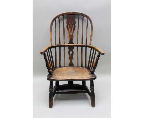 A 19th century stick and splat back armchair