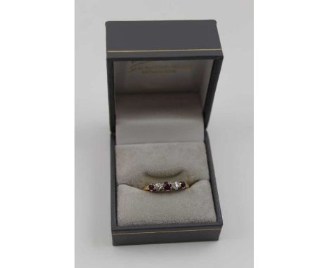 An 18ct gold ruby and diamond set ring, gross weight: 3.3g, ring size: O1/2