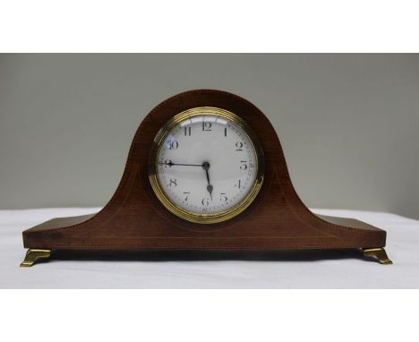 An Edwardian mahogany hat clock, circular dial with Arabic numerals, 8cm in diameter, raised on brass bracket feet