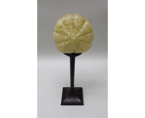 An Art Deco lamp, bakelite base, mottled shell glass shade, 47cm high