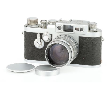 A Leitz Wetzlar Leica IIIg Delay 35mm Rangefinder Camera chrome, 1956, serial no.826281, with a Leitz Summarit f/1.5 5cm lens