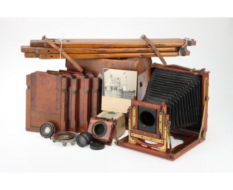 A Mahogany &amp; Brass Half Plate Field Camera Outfit with black tapered bellows, chamfered corners, single extension, Ross H